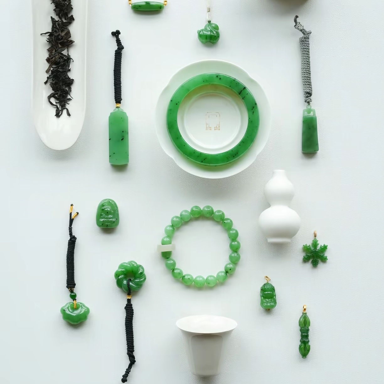 Deep green jade bangle and peace buckle set with black cord pendants