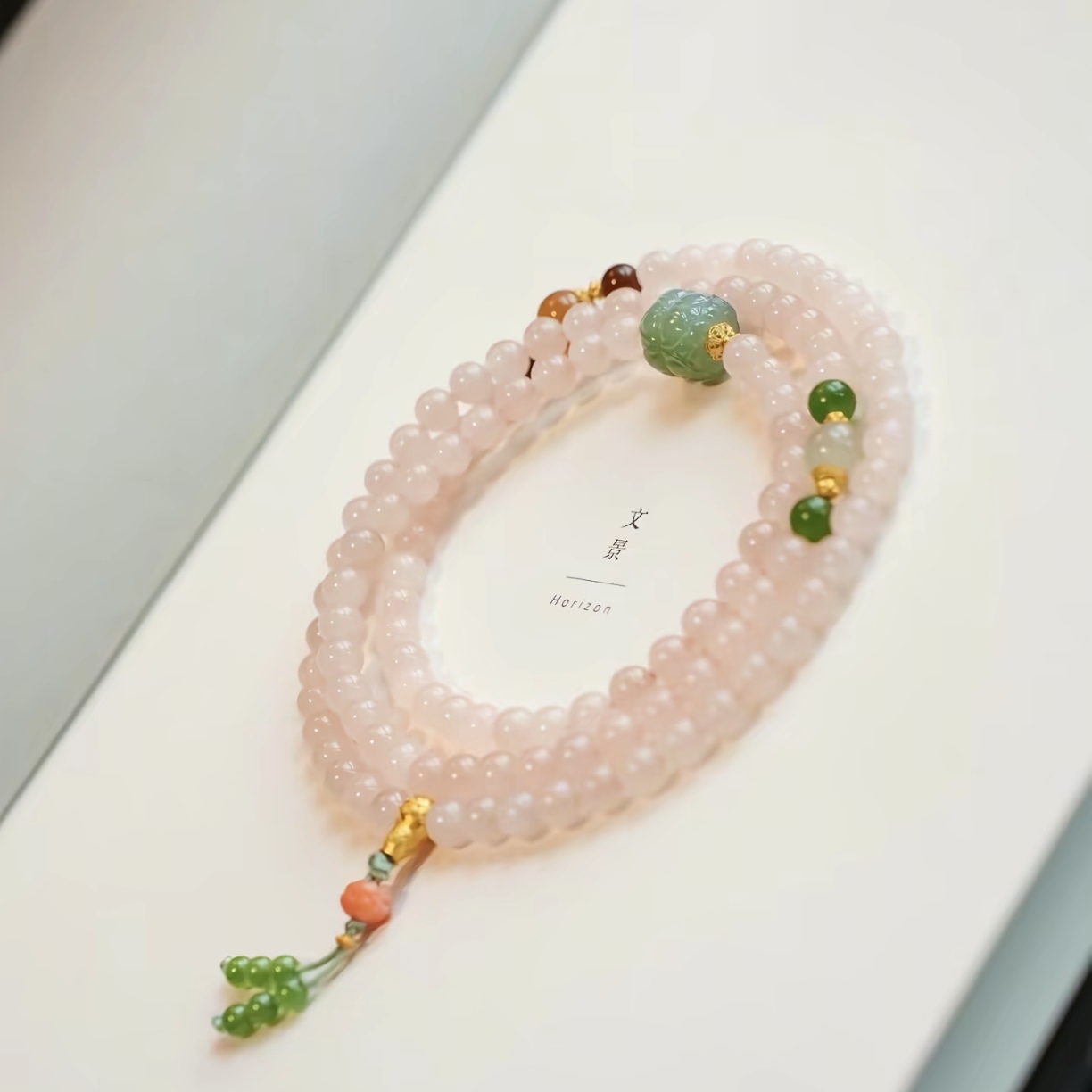 Tibetan multi-treasure bracelet with pink quartz, green jade and gold beads